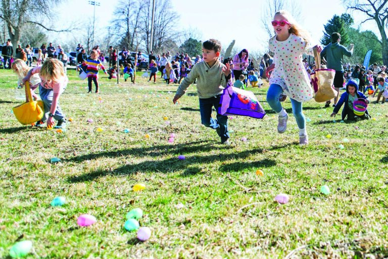 CHILDREN COLLECT EGGS DURING THE ANNUAL EASTER EGG HUNT HOSTED BY Wheat Ridge Parks and Recreation Saturday at Anderson Park. Hundreds turned out for the community tradition that featured 8,000 eggs dispersed across the park for children to collect.