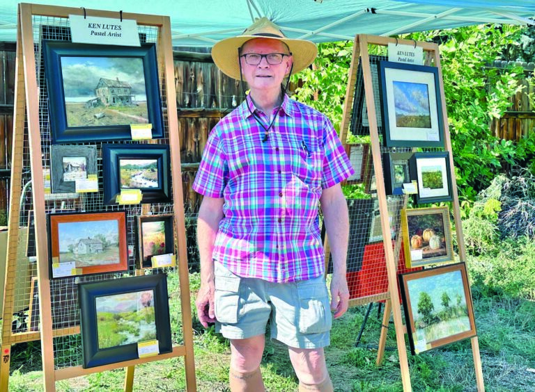 PASTELLIST KEN LUTES WITH HIS paintings on September 28 at Art on the Farm. PHOTO BY KEN LUTES